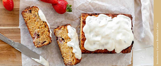 Strawberry Carrot cake on a paper with frosting spread