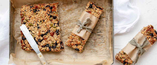 a baking pan with whole made granola bars on it