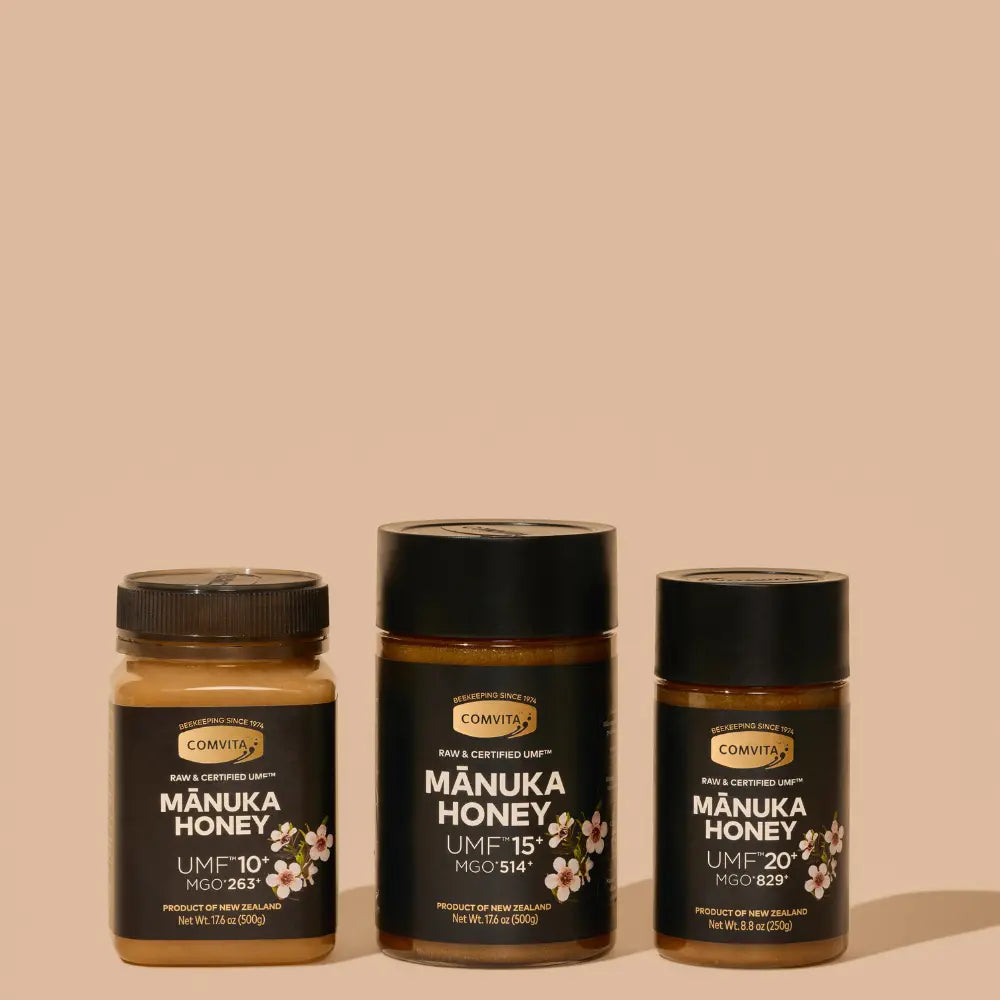 Three jars of Comvita Manuka Honey of various UMF and MGO grades