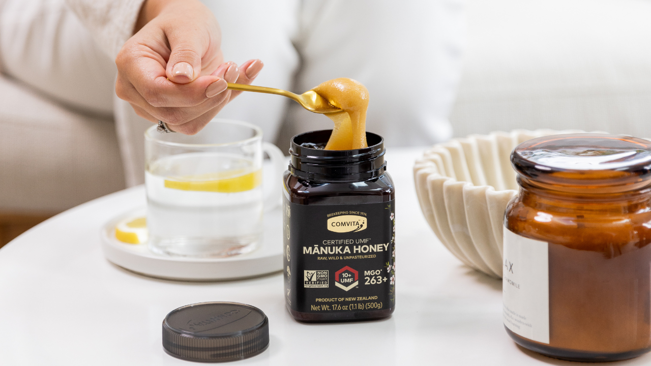spoonful of honey with top on table