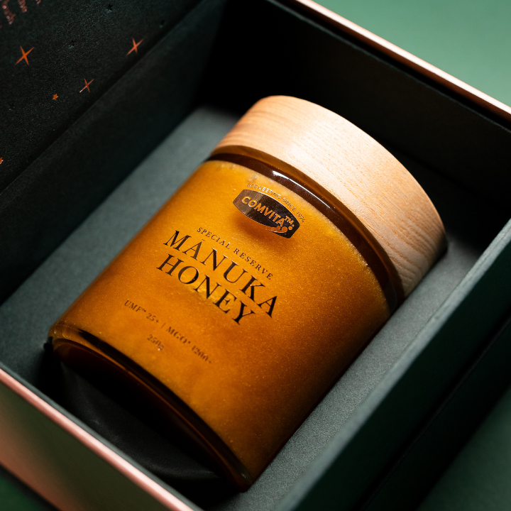 a jar of honey in a box