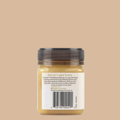 Jar of honey with a label on a beige background