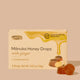 Box of Manuka Honey Drops with ginger on a beige background