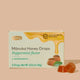Box of Manuka Honey Drops with peppermint flavor on a beige background