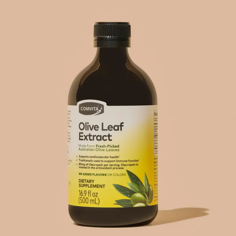 Bottle of Olive Leaf Extract with Comvita label on a beige background