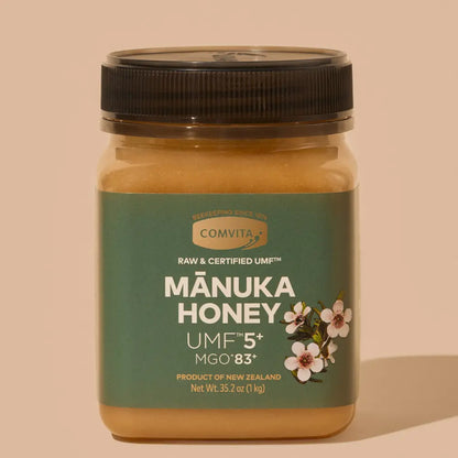 Jar of Manuka Honey with a green label on a beige background