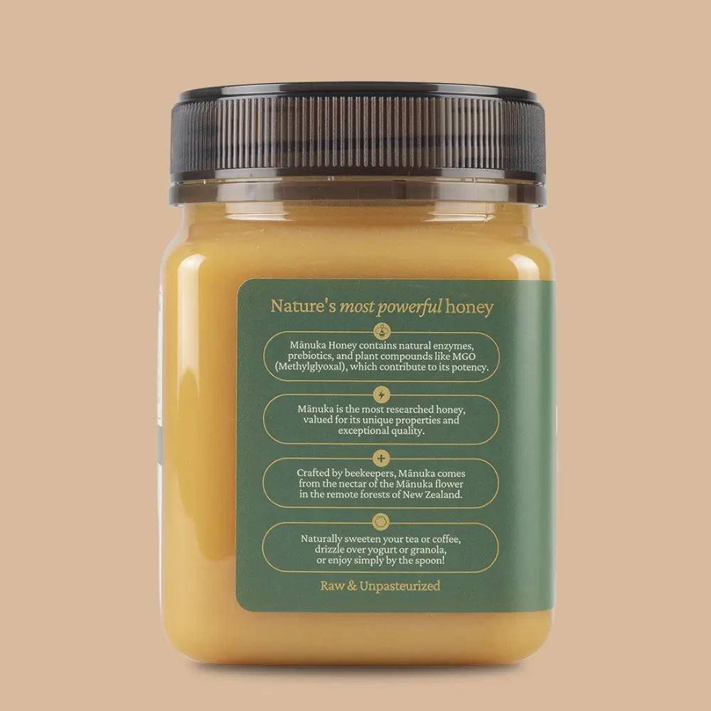 Jar of honey with a green label on a beige background