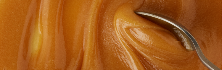 swirl of honey with spoon