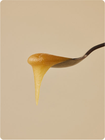 manuka honey dripping off a spoon