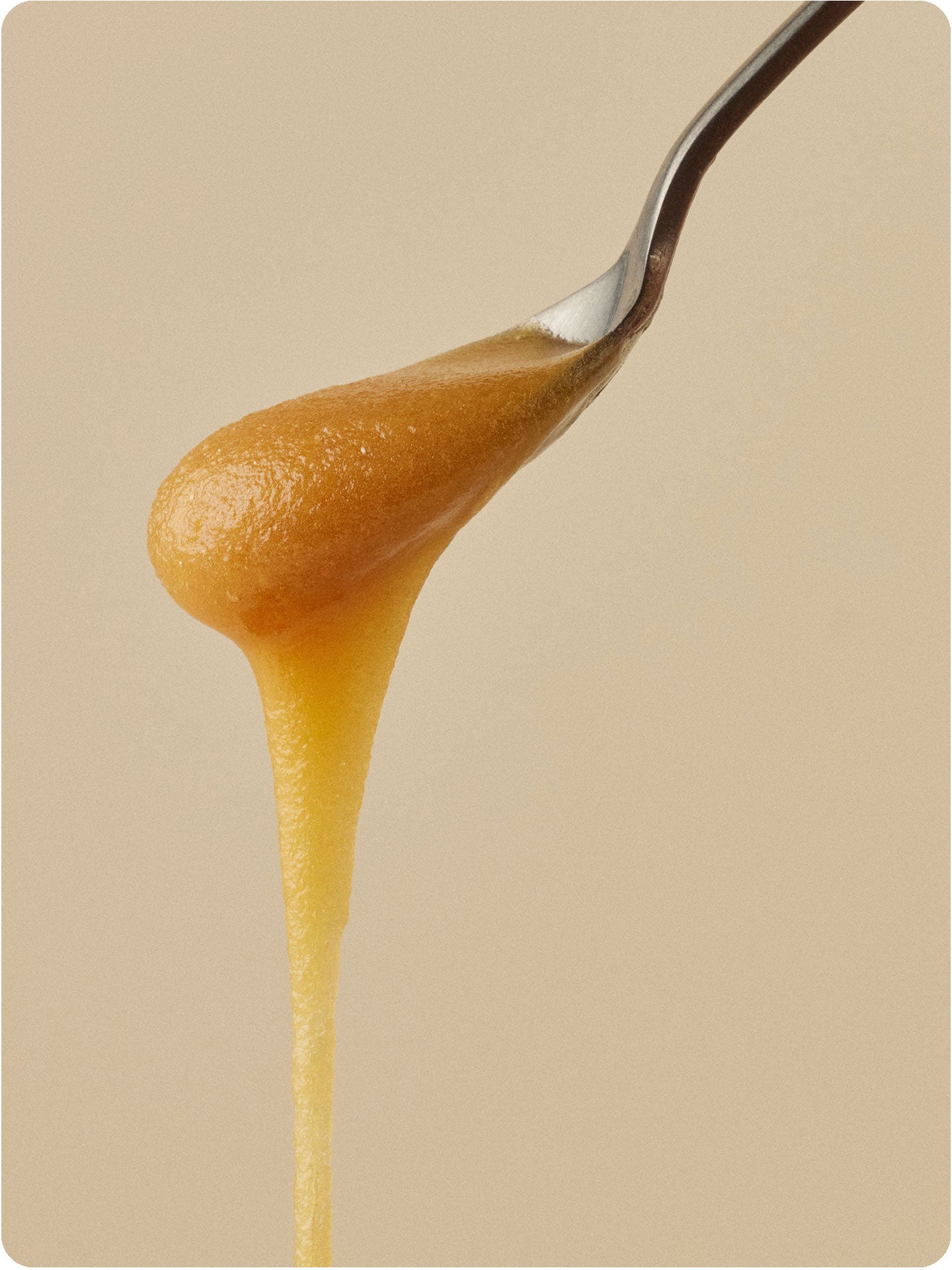 manuka honey dripping off a spoon